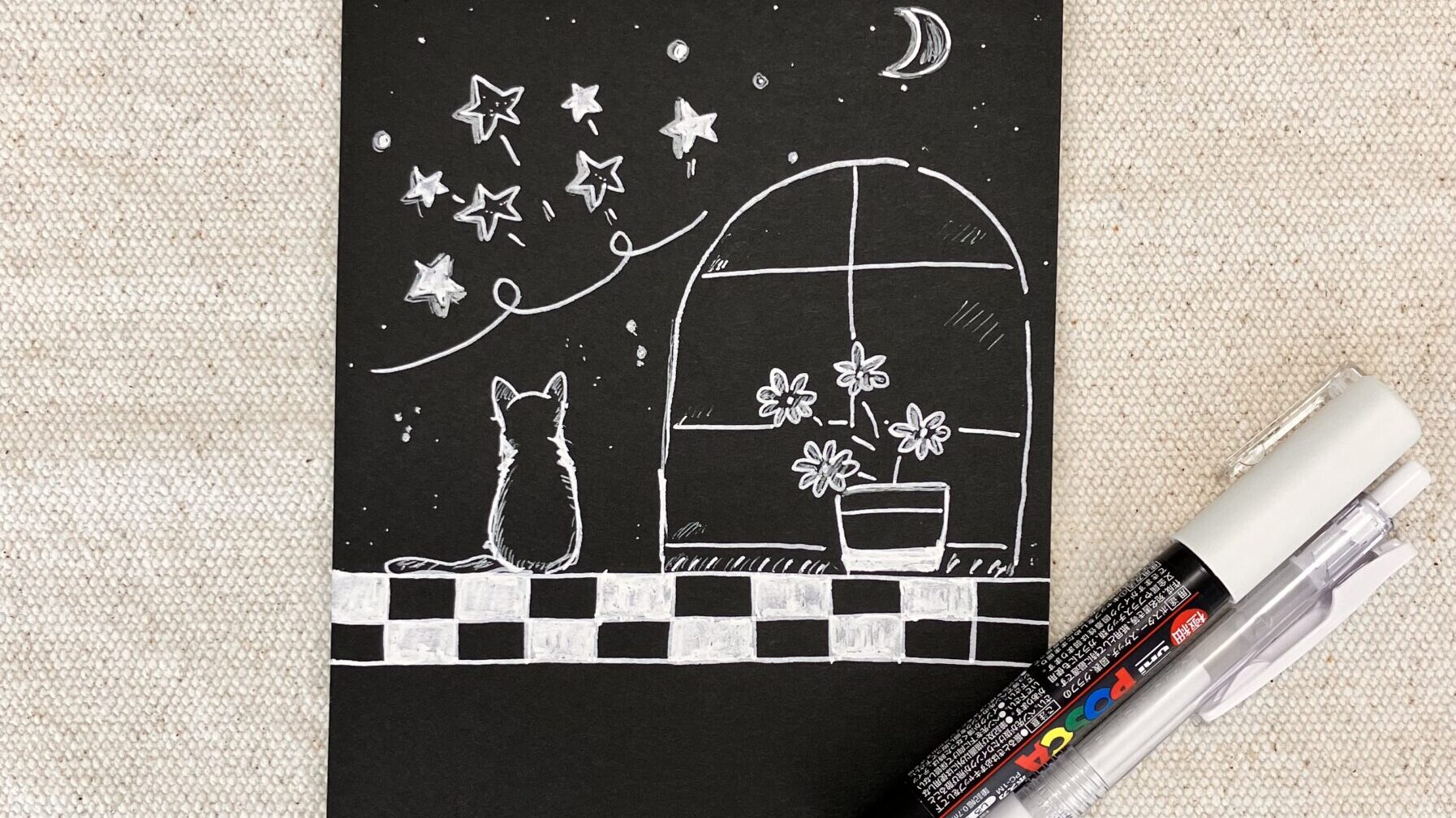 黒紙に描いた猫